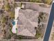 Aerial view of the home with pool, mature desert landscaping, driveway and tile roof at 10902 N 138Th Pl, Scottsdale, AZ 85259
