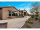 The backyard features a paved patio area ideal for outdoor entertaining with manicured desert landscaping at 10902 N 138Th Pl, Scottsdale, AZ 85259