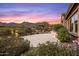Beautifully landscaped backyard featuring lush greenery and a view of the sunset sky at 10902 N 138Th Pl, Scottsdale, AZ 85259