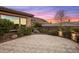 A serene backyard with lush greenery and desert landscaping under a beautiful evening sky at 10902 N 138Th Pl, Scottsdale, AZ 85259