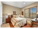 Bedroom with neutral walls, plush rug, window, and a comfortable queen bed at 10902 N 138Th Pl, Scottsdale, AZ 85259