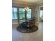 Cozy dining area with wood table, chandelier, and natural light at 10902 N 138Th Pl, Scottsdale, AZ 85259