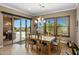 Elegant dining area with sliding doors, natural light, and views of the outdoor patio at 10902 N 138Th Pl, Scottsdale, AZ 85259