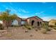 Elegant single-story home featuring desert landscaping and a welcoming brick facade at 10902 N 138Th Pl, Scottsdale, AZ 85259