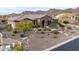 Charming desert home featuring manicured desert landscaping, covered entry and tile roof at 10902 N 138Th Pl, Scottsdale, AZ 85259