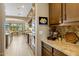 Spacious kitchen featuring granite countertops, custom cabinets, and stainless steel appliances at 10902 N 138Th Pl, Scottsdale, AZ 85259