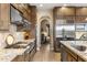 Modern kitchen featuring stainless steel appliances, granite countertops, and custom cabinetry at 10902 N 138Th Pl, Scottsdale, AZ 85259