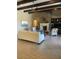 Bright living room with wood beams, fireplace, and cozy seating area at 10902 N 138Th Pl, Scottsdale, AZ 85259