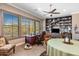 Cozy office with custom built-ins, desk, and natural light from shuttered windows at 10902 N 138Th Pl, Scottsdale, AZ 85259
