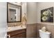 Chic powder room featuring elegant fixtures, custom tile, and modern decor at 10902 N 138Th Pl, Scottsdale, AZ 85259