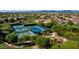 Pickleball courts with mature landscaping in a desert community at 10999 E Acoma Dr, Scottsdale, AZ 85255