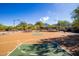 Community basketball court with mountain views and lush landscaping at 10999 E Acoma Dr, Scottsdale, AZ 85255