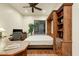 Home office featuring a bed concealed by a cabinet and built-in storage at 10999 E Acoma Dr, Scottsdale, AZ 85255