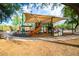 Playground with covered play structure, slide and desert landscape at 10999 E Acoma Dr, Scottsdale, AZ 85255