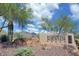 Community entrance sign with desert landscaping and mountain views at 10999 E Acoma Dr, Scottsdale, AZ 85255