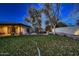 Expansive backyard with lush lawn and mature trees, offering plenty of room for outdoor activities at 11021 N 74Th St, Scottsdale, AZ 85260