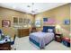 Cozy bedroom with natural light, ceiling fan, and American flag at 11021 N 74Th St, Scottsdale, AZ 85260