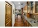Butler's pantry featuring wood cabinets, and granite countertops at 11021 N 74Th St, Scottsdale, AZ 85260