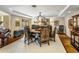 Elegant dining room featuring tray ceiling, decorative chandelier, and seating for eight at 11021 N 74Th St, Scottsdale, AZ 85260