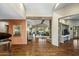 Elegant foyer featuring hardwood floors, an exposed wood beam, and an open view to the living area at 11021 N 74Th St, Scottsdale, AZ 85260