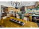 Spacious kitchen with custom cabinets, granite counters, stainless appliances, and decorative lighting at 11021 N 74Th St, Scottsdale, AZ 85260