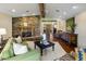 Cozy living room with a stone fireplace, creating a warm and inviting atmosphere at 11021 N 74Th St, Scottsdale, AZ 85260