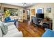 Inviting living room with hardwood floors and access to backyard patio at 11021 N 74Th St, Scottsdale, AZ 85260