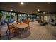 Large covered patio with a dining area, fireplace, and ample seating for entertaining guests at 11021 N 74Th St, Scottsdale, AZ 85260