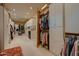 Extensive walk-in closet with custom shelving, hanging racks, and dedicated storage spaces at 11021 N 74Th St, Scottsdale, AZ 85260