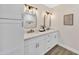 Updated bathroom with dual sinks, granite countertops, and bright mirrors at 1108 E Villa Rita Dr, Phoenix, AZ 85022