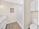 Bathroom features a walk-in shower with white tile and updated vanity at 1108 E Villa Rita Dr, Phoenix, AZ 85022