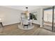 Bright dining room with seating for four, stylish lighting, and natural light, perfect for entertaining at 1108 E Villa Rita Dr, Phoenix, AZ 85022
