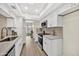 Updated kitchen features white cabinets, modern appliances, and quartz countertops at 1108 E Villa Rita Dr, Phoenix, AZ 85022