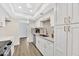 Bright kitchen features white cabinets, stainless steel appliances, and recessed lighting at 1108 E Villa Rita Dr, Phoenix, AZ 85022