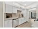 Modern kitchen with bright cabinets, stainless steel appliances, and wood flooring at 1108 E Villa Rita Dr, Phoenix, AZ 85022