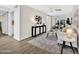 Well-lit living space with modern accents, wood-look flooring, and a welcoming atmosphere at 1108 E Villa Rita Dr, Phoenix, AZ 85022