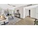 Bright living room featuring wood floors, modern decor, and an inviting open-concept design at 1108 E Villa Rita Dr, Phoenix, AZ 85022