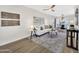 Inviting living room showcasing modern furnishings, wood floors, and an open layout to the dining area at 1108 E Villa Rita Dr, Phoenix, AZ 85022