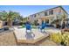 Relaxing backyard with a pool, comfortable seating, and beautiful desert landscaping at 11933 N 140Th Ln, Surprise, AZ 85379