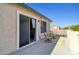Private balcony featuring sliding glass doors, outdoor seating, and sunny views at 11933 N 140Th Ln, Surprise, AZ 85379