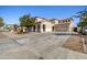 Spacious home exterior featuring large driveway and well-maintained landscaping at 11933 N 140Th Ln, Surprise, AZ 85379