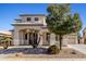 Charming two-story home with landscaped front yard and inviting entrance at 11933 N 140Th Ln, Surprise, AZ 85379