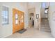Grand foyer featuring high ceilings, tile flooring, and an elegant staircase at 11933 N 140Th Ln, Surprise, AZ 85379