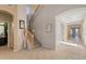 Spacious foyer with tile flooring and staircase leading to the upper level at 11933 N 140Th Ln, Surprise, AZ 85379