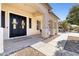 Inviting front porch with double doors, stylish accents, and attractive landscaping at 11933 N 140Th Ln, Surprise, AZ 85379