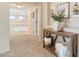 Well-lit upstairs hallway with view of loft, complemented by tasteful decorations and functional furniture at 11933 N 140Th Ln, Surprise, AZ 85379