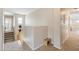 Upstairs hallway with a staircase and views to other rooms, designed for easy navigation and accessibility at 11933 N 140Th Ln, Surprise, AZ 85379