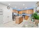 Bright kitchen featuring wood cabinets, stainless steel appliances, granite countertops, and a center island at 11933 N 140Th Ln, Surprise, AZ 85379