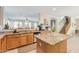 Kitchen showcasing granite counters, stainless steel appliances, and an open layout to the living area at 11933 N 140Th Ln, Surprise, AZ 85379