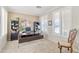 Bright home office featuring built-in bookshelves, modern desk, neutral walls, and plantation shutters at 11933 N 140Th Ln, Surprise, AZ 85379